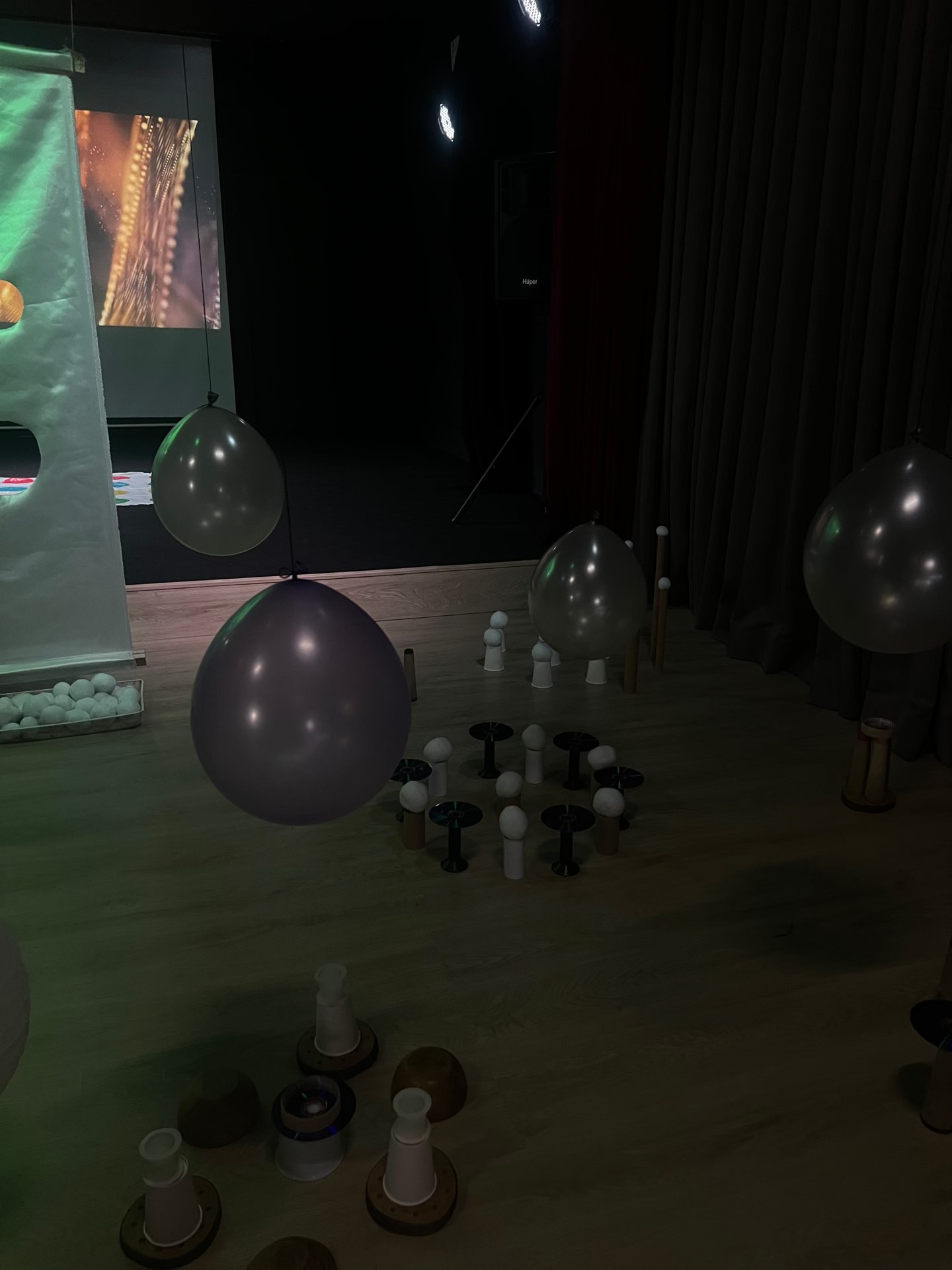 Other Worlds - balloons and spools in low light